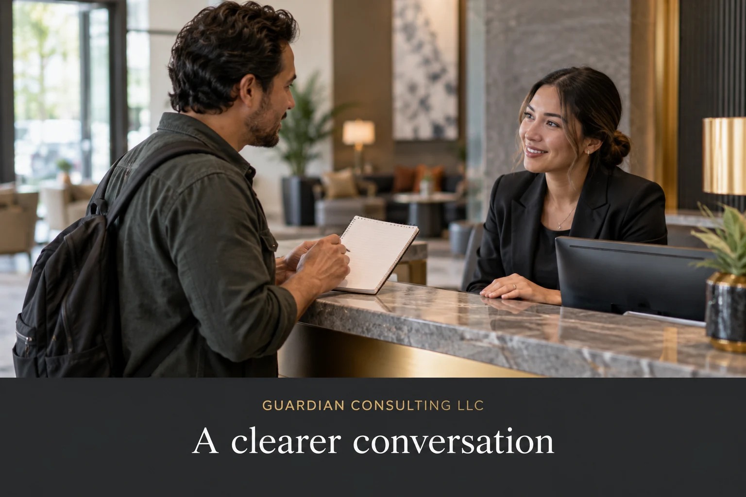Illustrative lobby scene: a visitor and desk employee communicate using a notepad.